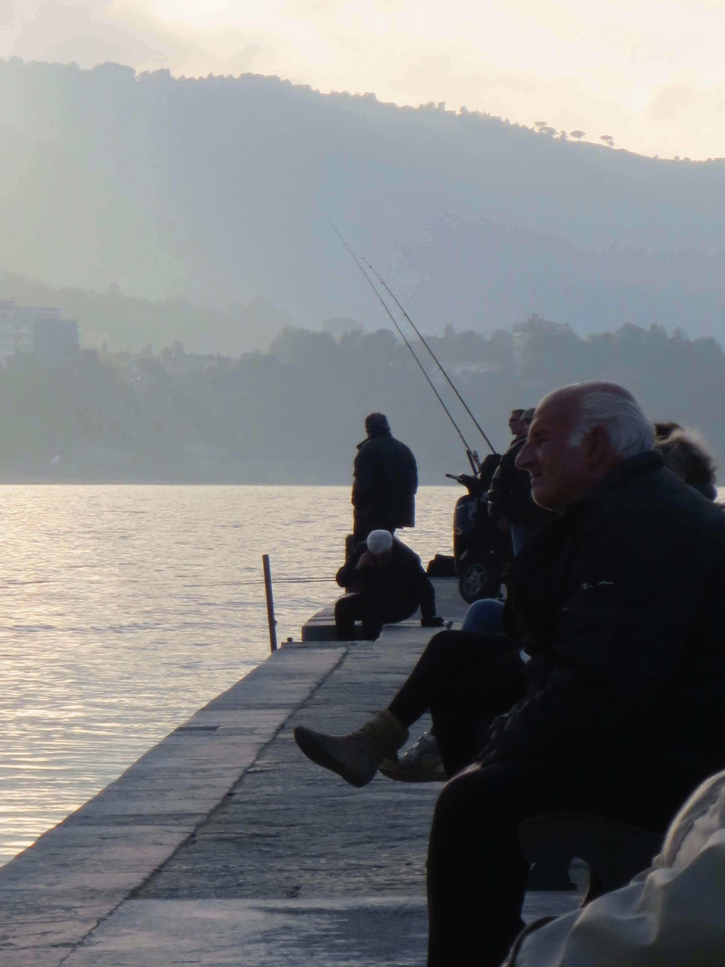 Old men fishing at Cefalu pier.
