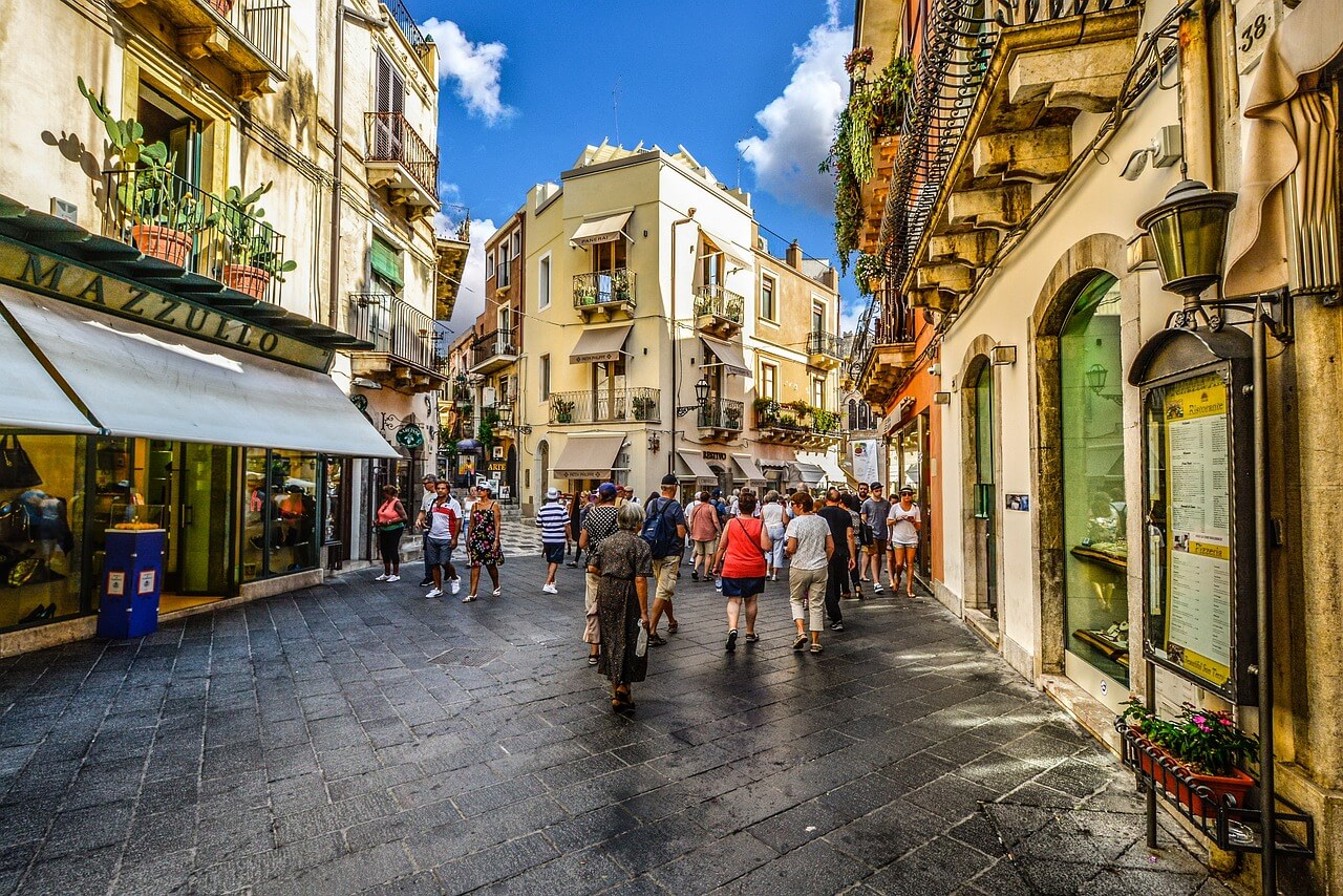 People walking on Corso Umberto.