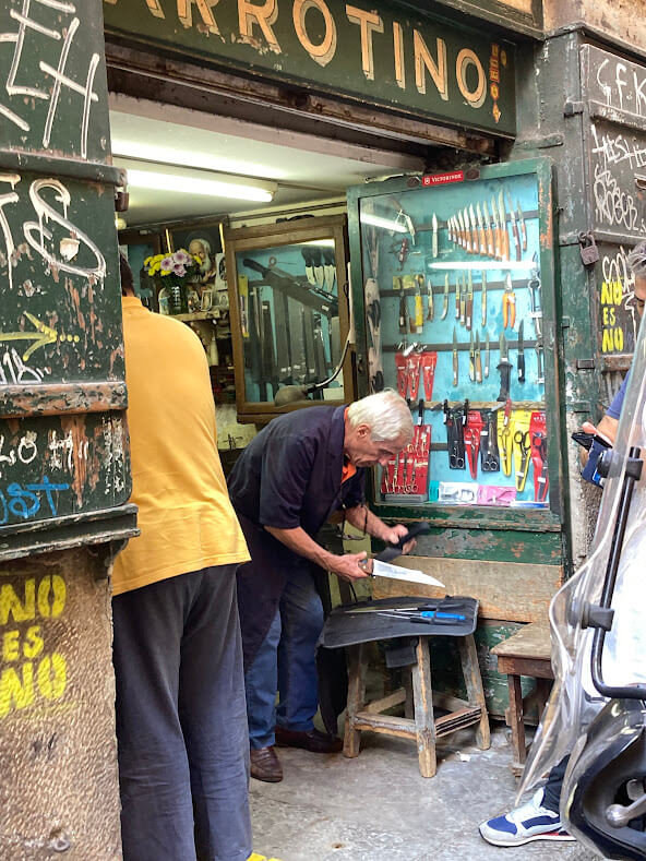 Knife sharpener in Vucciria Market, Palermo, Sicily