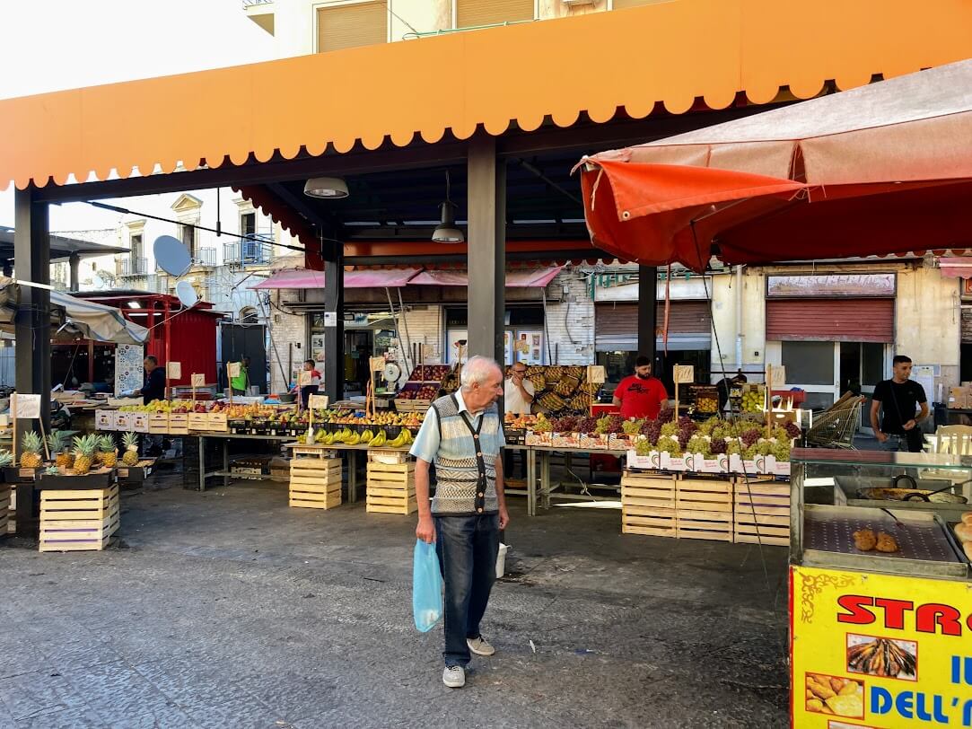 Shopping at food market in Sicily, Italy.