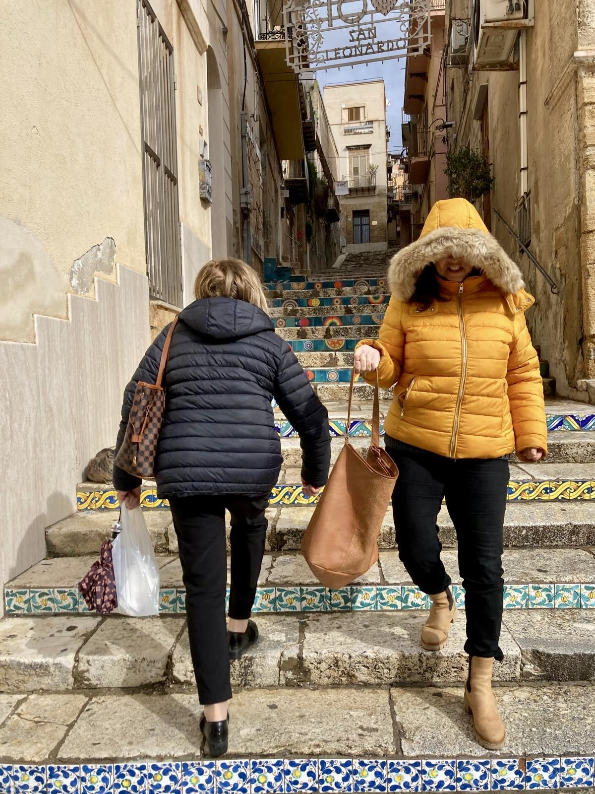 Two Ladies Walking the Steps in Sciacca
